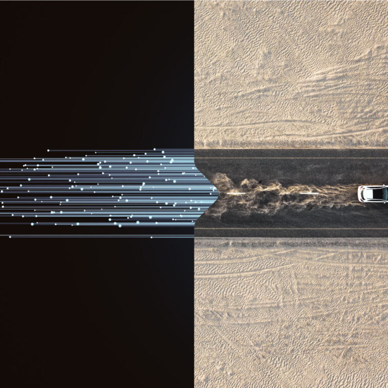 Tech and car on desert road